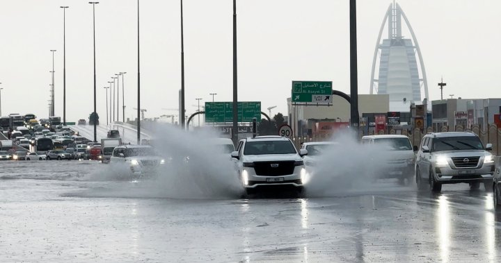 Dubai airport diverts flights as heavy rains flood runway, roads – National [Video]
