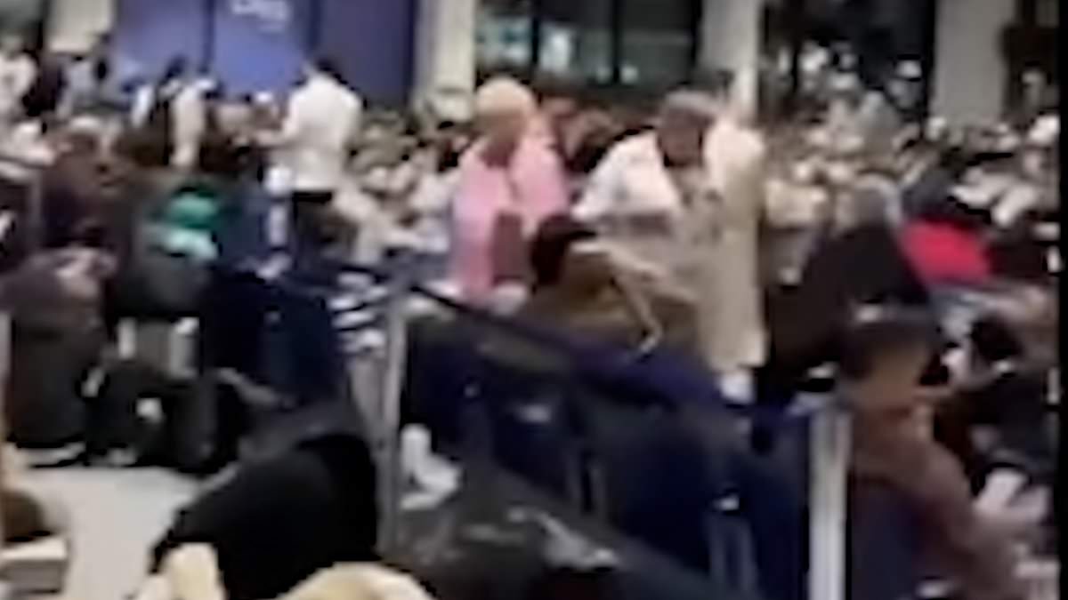 Dubai airport pleads with travellers ‘Don’t come!’ with floods still causing chaos and families including Brits trying to flee trashed luxury resorts – as time-lapse video shows how 18 months’ rain fell in one day