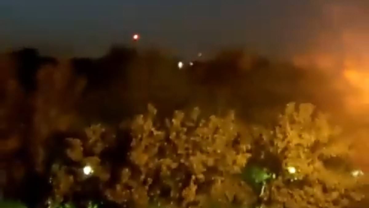 Israel strikes back at Iran: Explosions rock airbase in city linked to Tehran’s nuke program but US denies nuclear facilities were targeted after Netanyahu launched attack in defiance of Biden [Video]