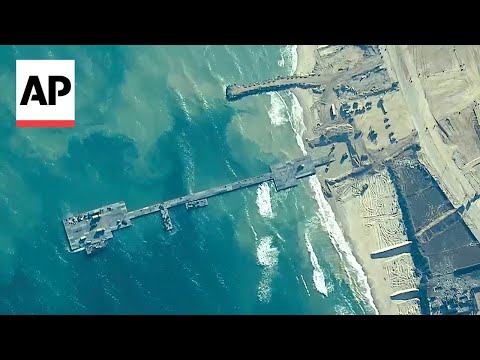 Trucks arrive to take aid from new Gaza pier [Video]
